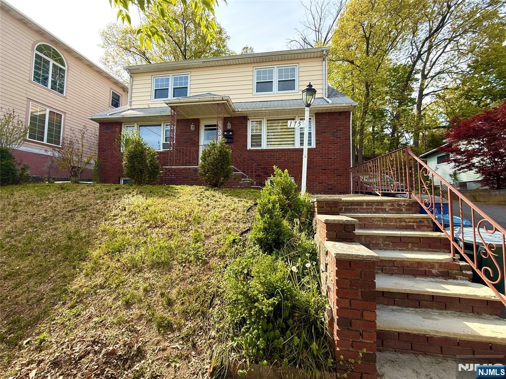 175 Van Winkle Street, Unit 2 East Rutherford, NJ 07073 - Photo 2 of 20 a view of a house with backyard and trees