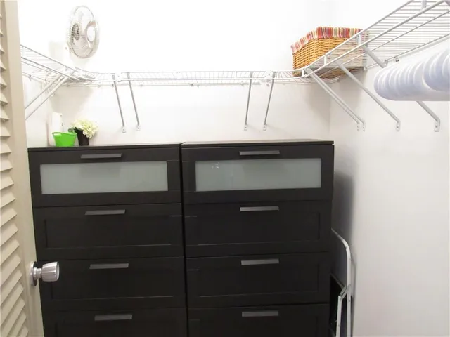 a bathroom with a shower and a sink