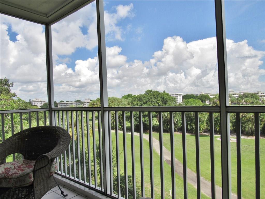 2661 South Course Drive, Unit 404 Pompano Beach, FL 33069 - Photo 3 of 16 a view of a balcony with lake view and sitting space