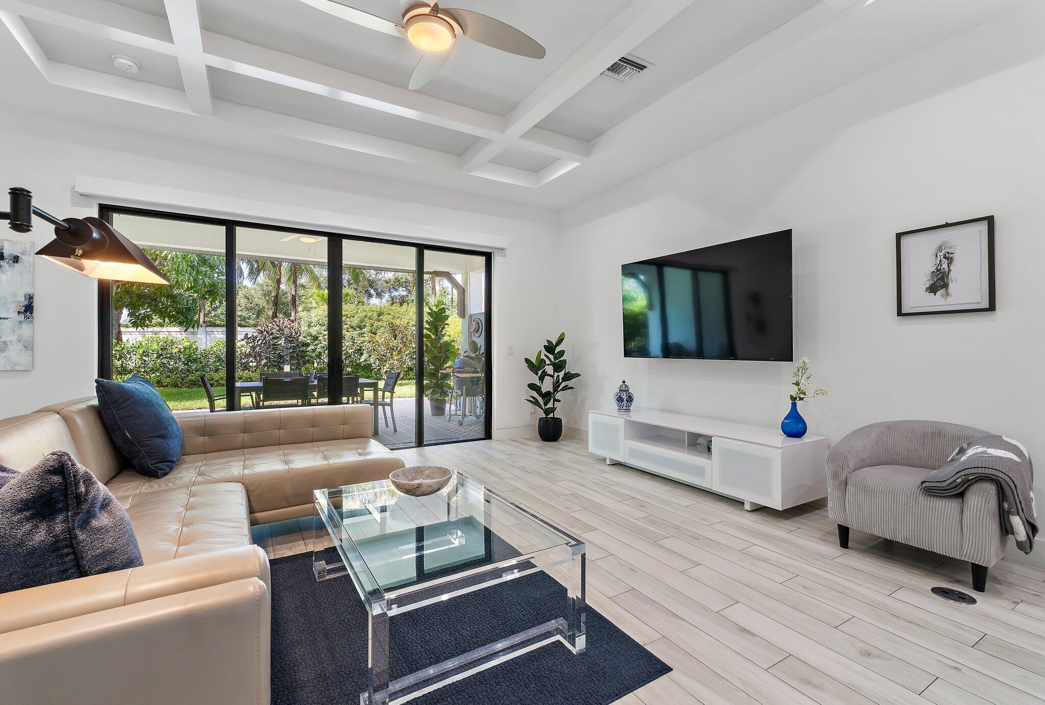 2908 Gin Berry Way West Palm Beach, FL 33401 - Photo 14 of 70 a living room with furniture and a flat screen tv
