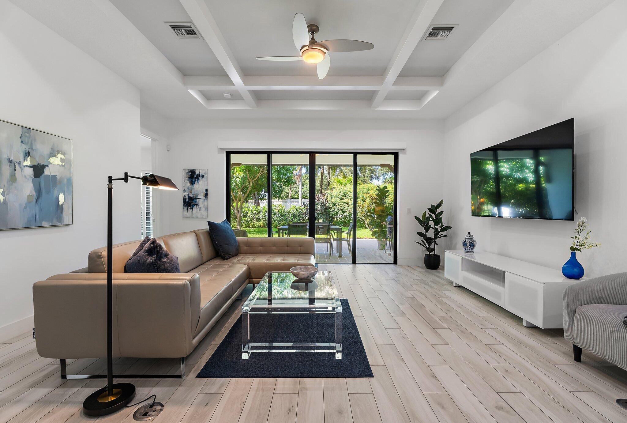 2908 Gin Berry Way West Palm Beach, FL 33401 - Photo 15 of 70 a living room with furniture and a flat screen tv