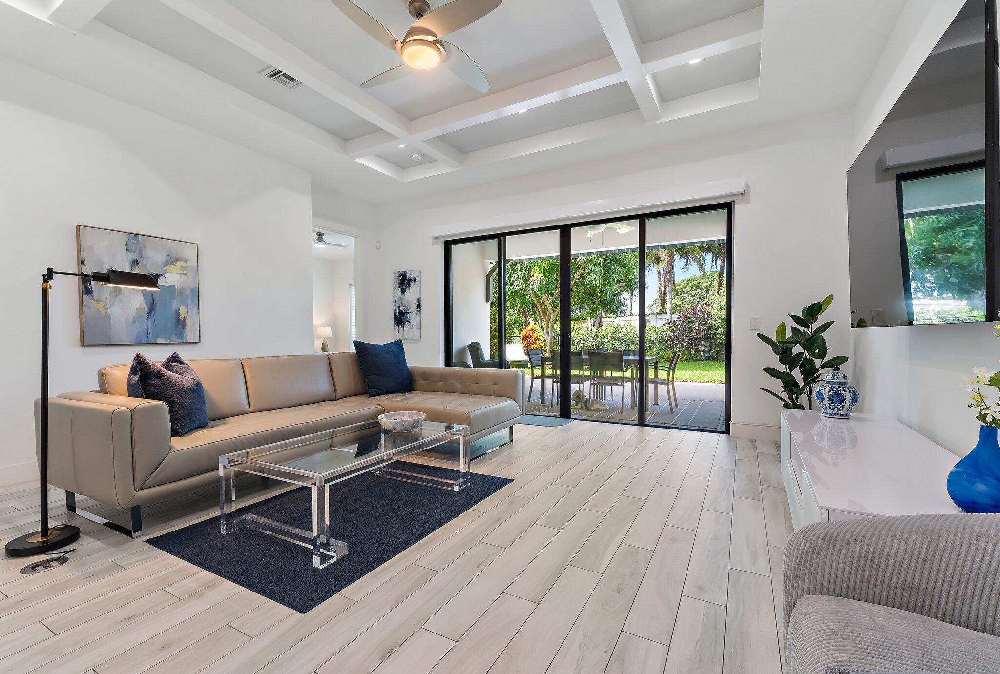 2908 Gin Berry Way West Palm Beach, FL 33401 - Photo 16 of 70 a living room with furniture and a large window with outer view