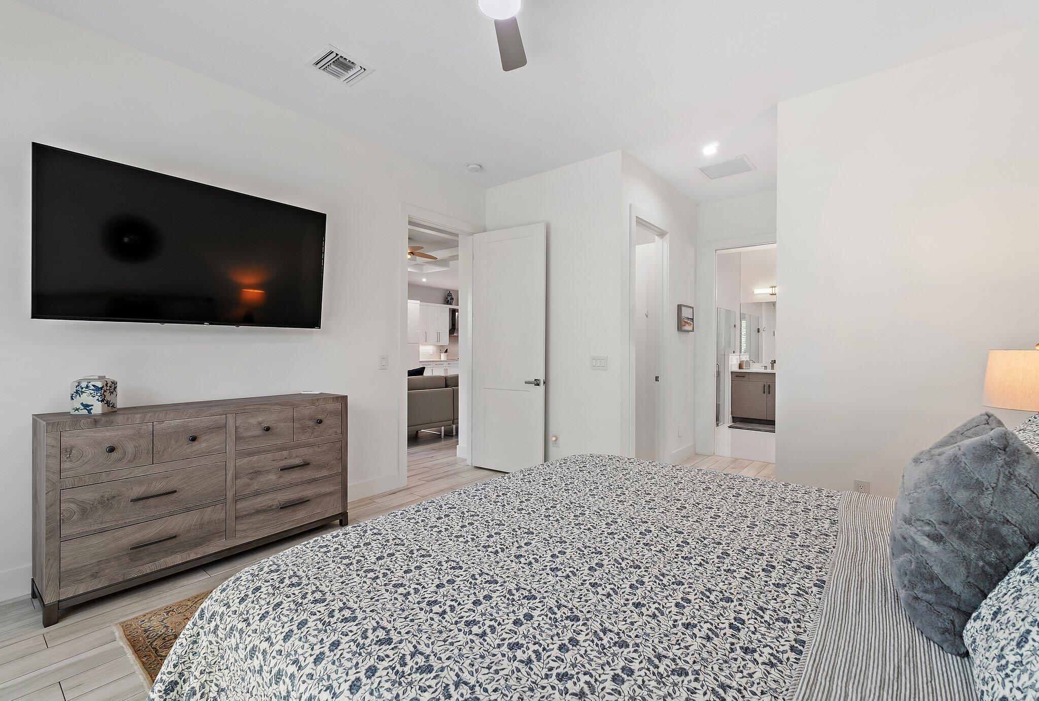 2908 Gin Berry Way West Palm Beach, FL 33401 - Photo 20 of 70 a living room with furniture and a flat screen tv