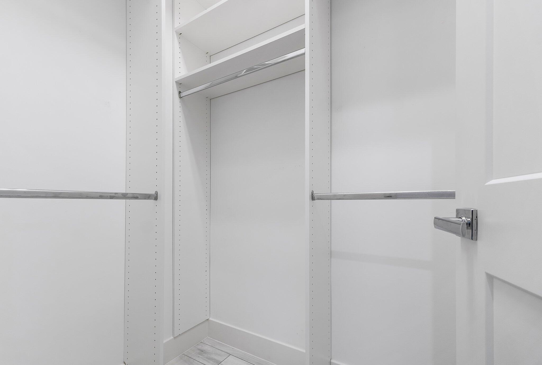 2908 Gin Berry Way West Palm Beach, FL 33401 - Photo 23 of 70 a bathroom with a glass shower door