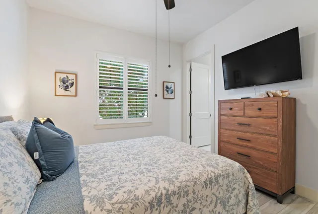 a view of a chairs and table in patio with a yard
