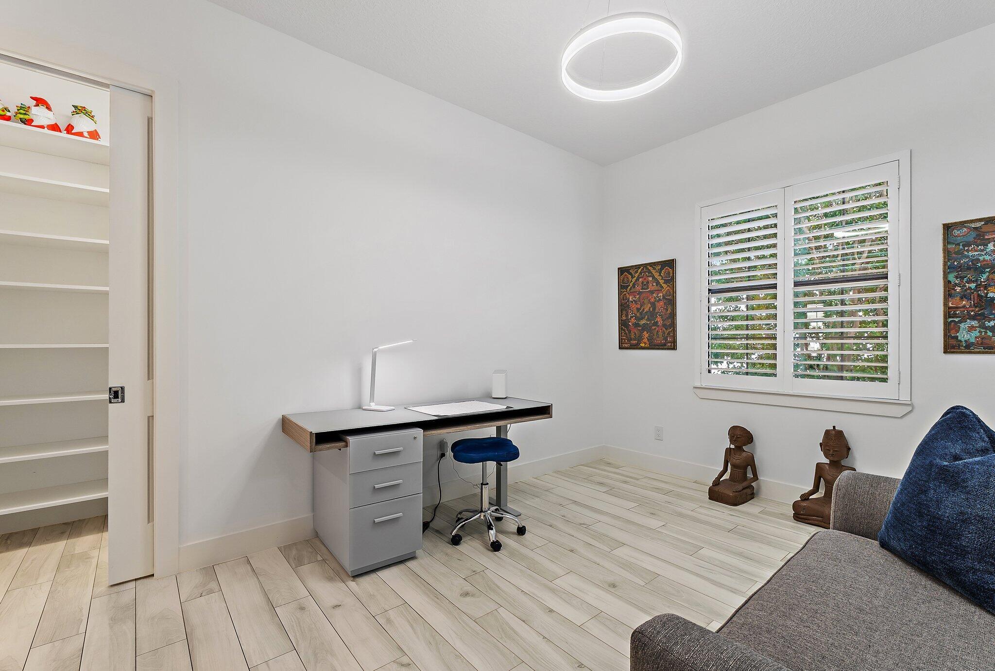 2908 Gin Berry Way West Palm Beach, FL 33401 - Photo 31 of 70 a view of a workspace with furniture and windows