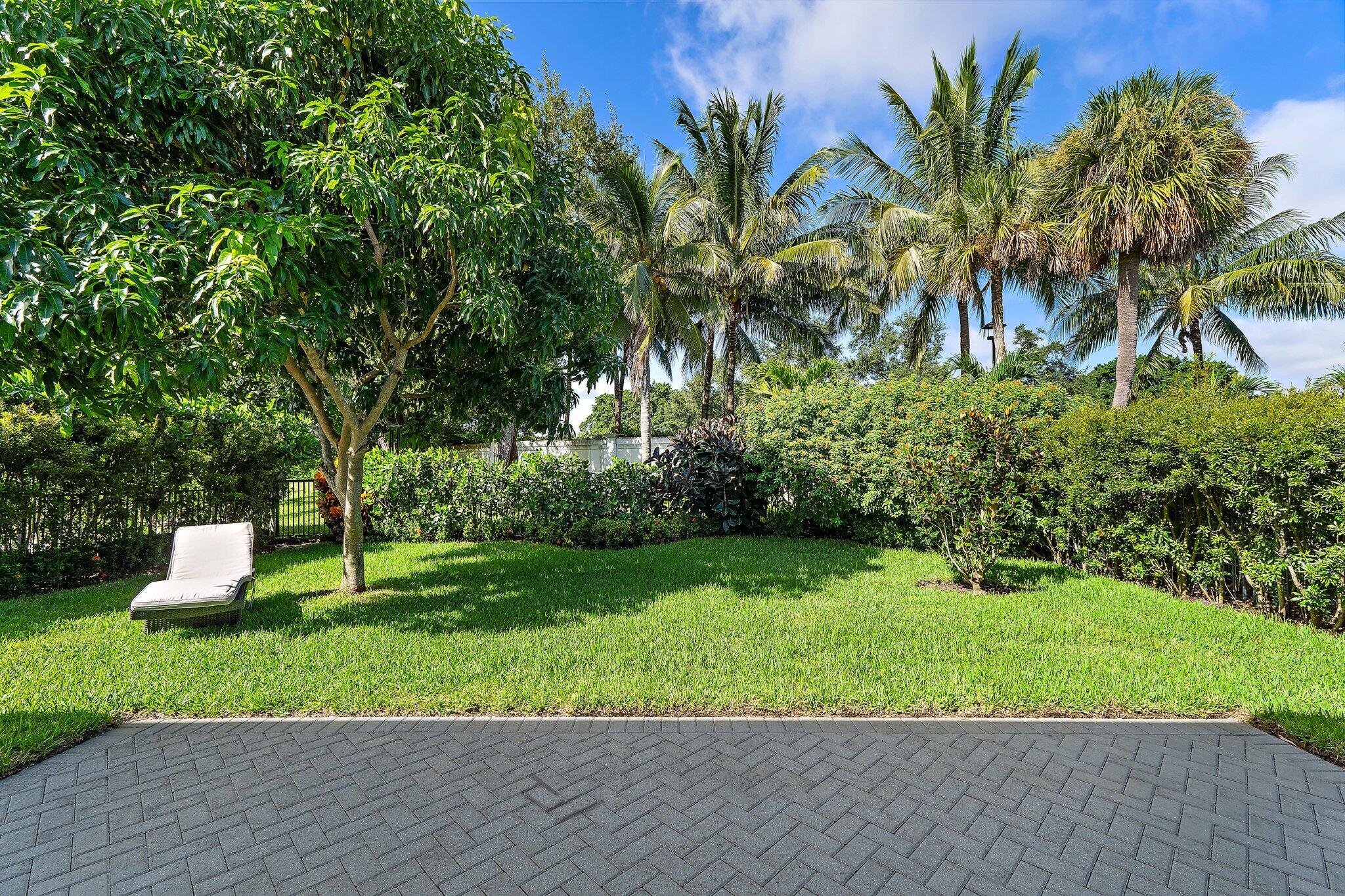 2908 Gin Berry Way West Palm Beach, FL 33401 - Photo 40 of 70 a garden with palm trees