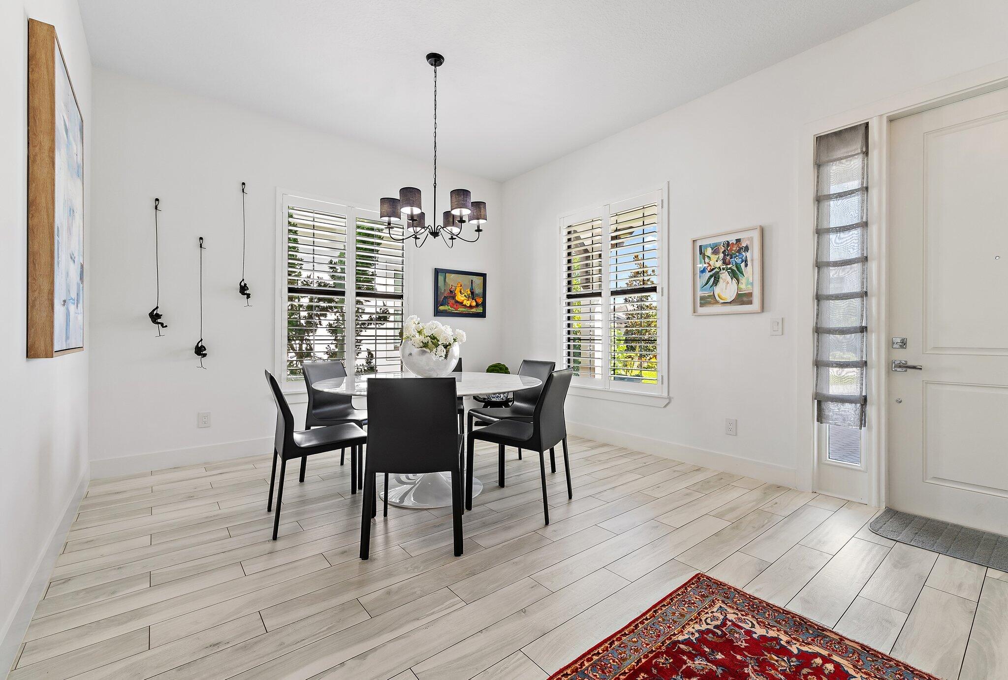 2908 Gin Berry Way West Palm Beach, FL 33401 - Photo 4 of 70 a view of a dining room with furniture window and wooden floor
