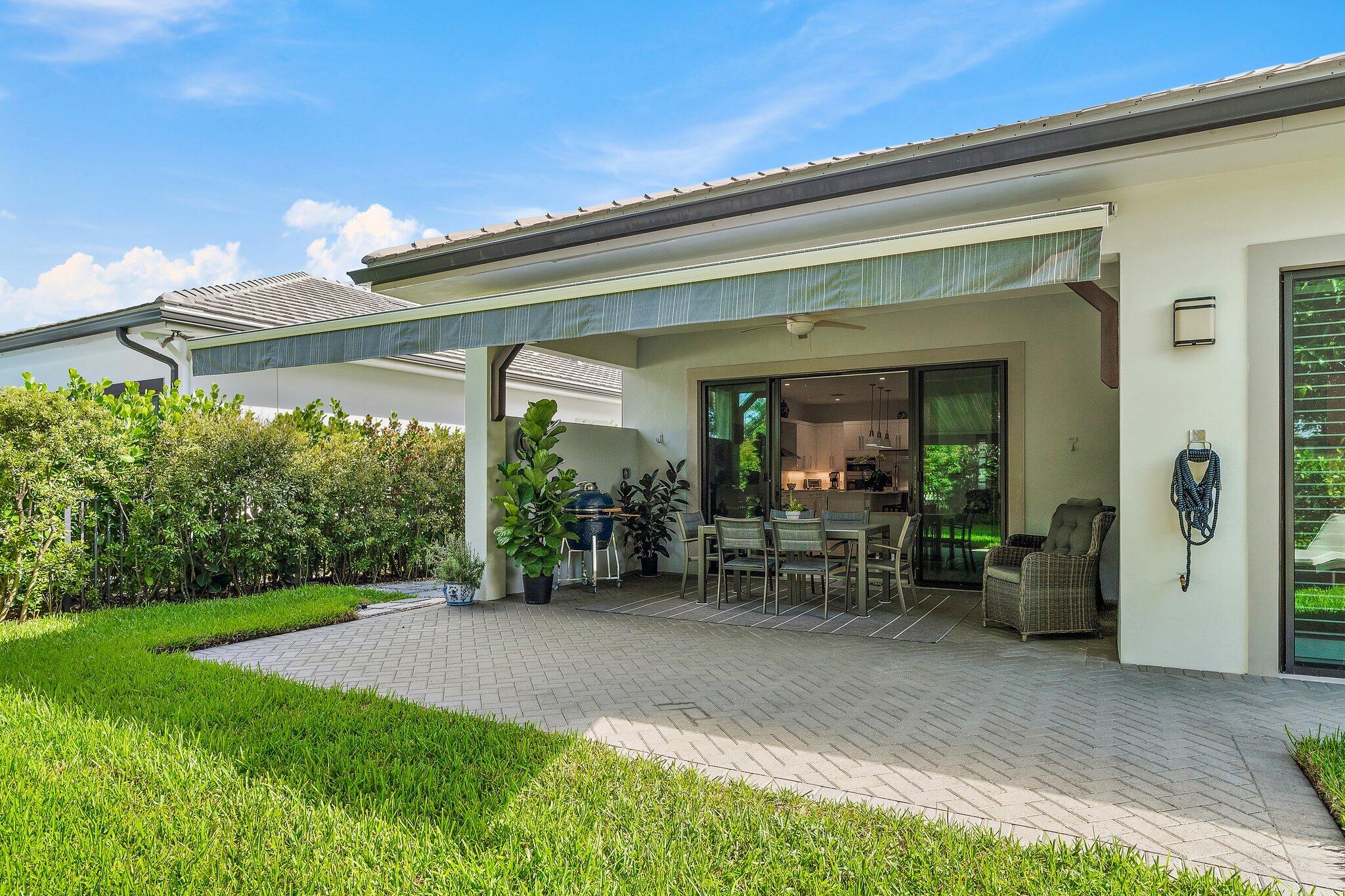 2908 Gin Berry Way West Palm Beach, FL 33401 - Photo 45 of 70 a view of a house with porch and garden