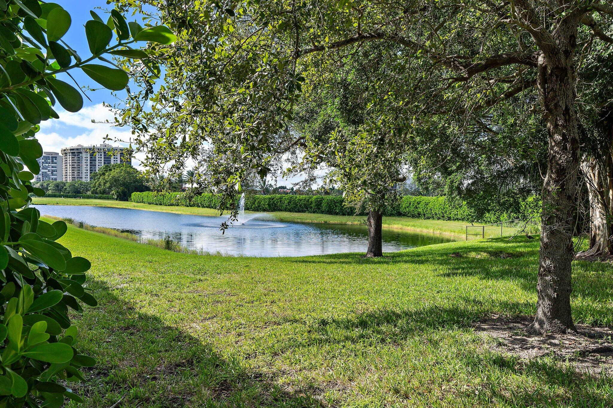 2908 Gin Berry Way West Palm Beach, FL 33401 - Photo 48 of 70 a view of a garden with a bench