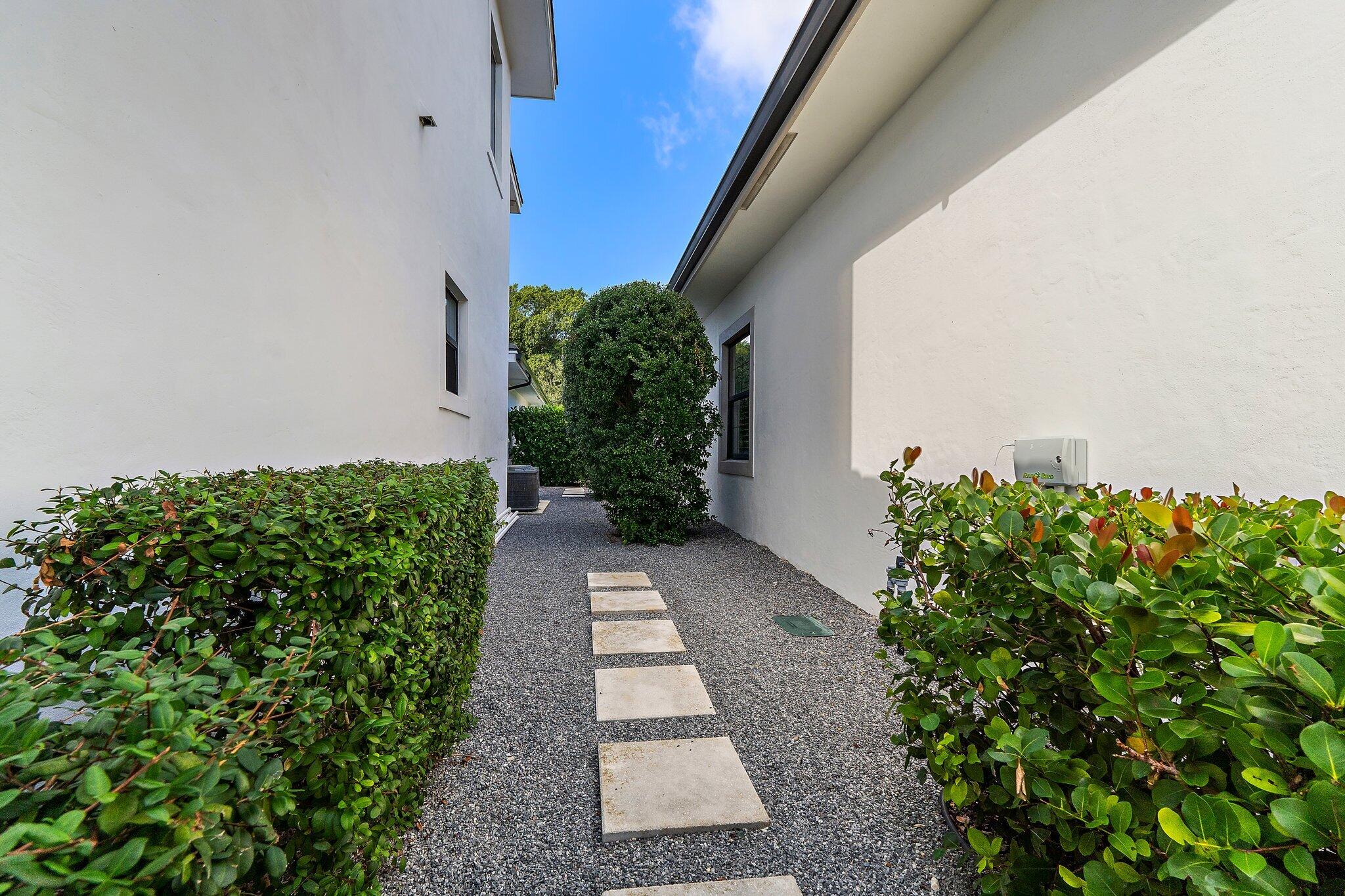 2908 Gin Berry Way West Palm Beach, FL 33401 - Photo 49 of 70 a view of a pathway both side of flower