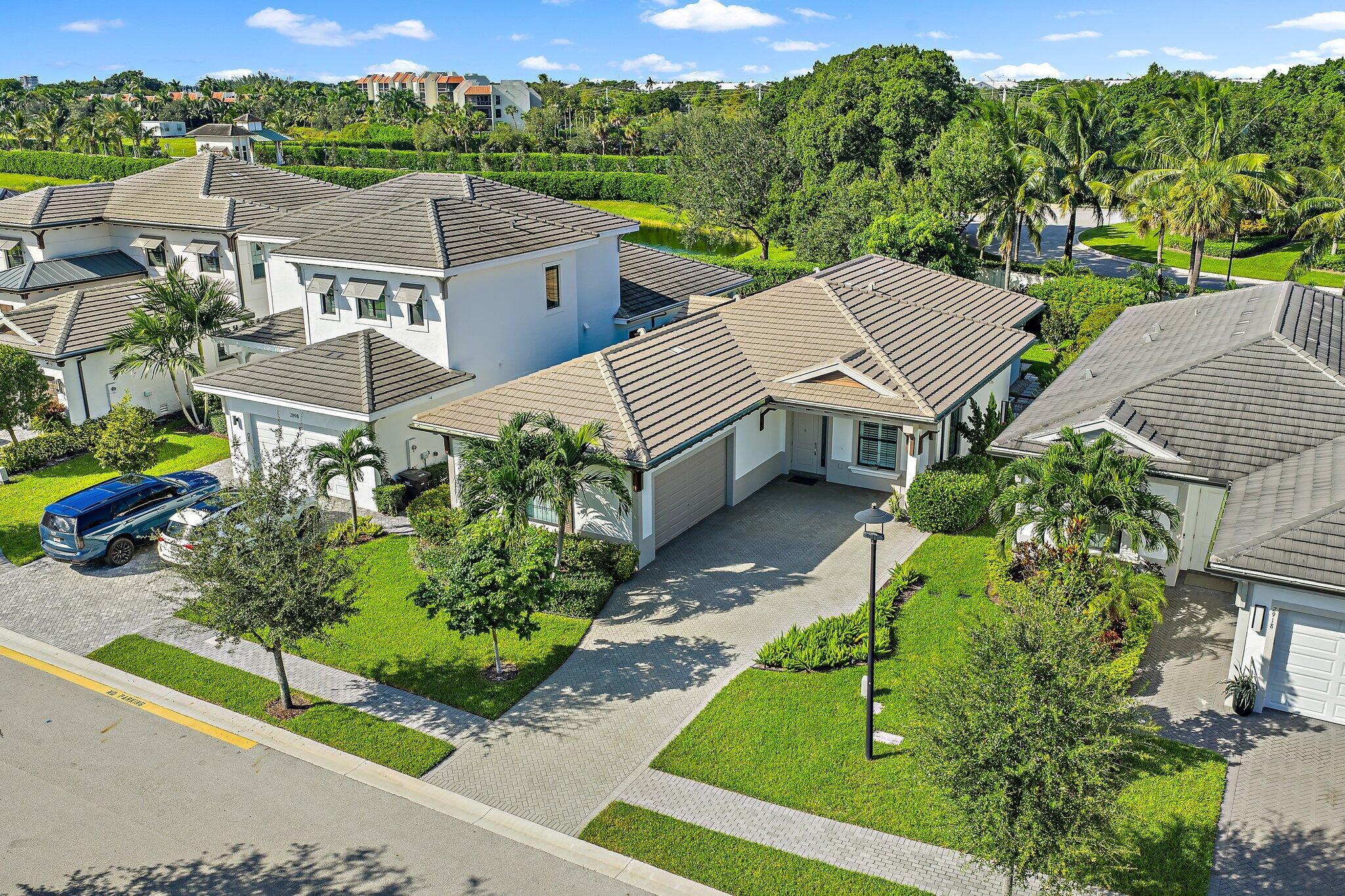 2908 Gin Berry Way West Palm Beach, FL 33401 - Photo 52 of 70 an aerial view of a house with a garden