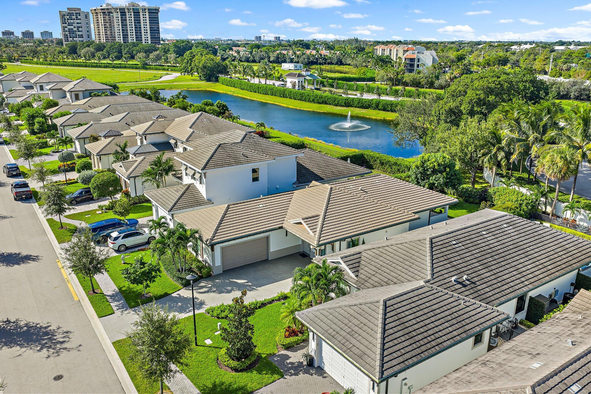 2908 Gin Berry Way West Palm Beach, FL 33401 - Photo 53 of 70 an aerial view of a house with a garden and lake view