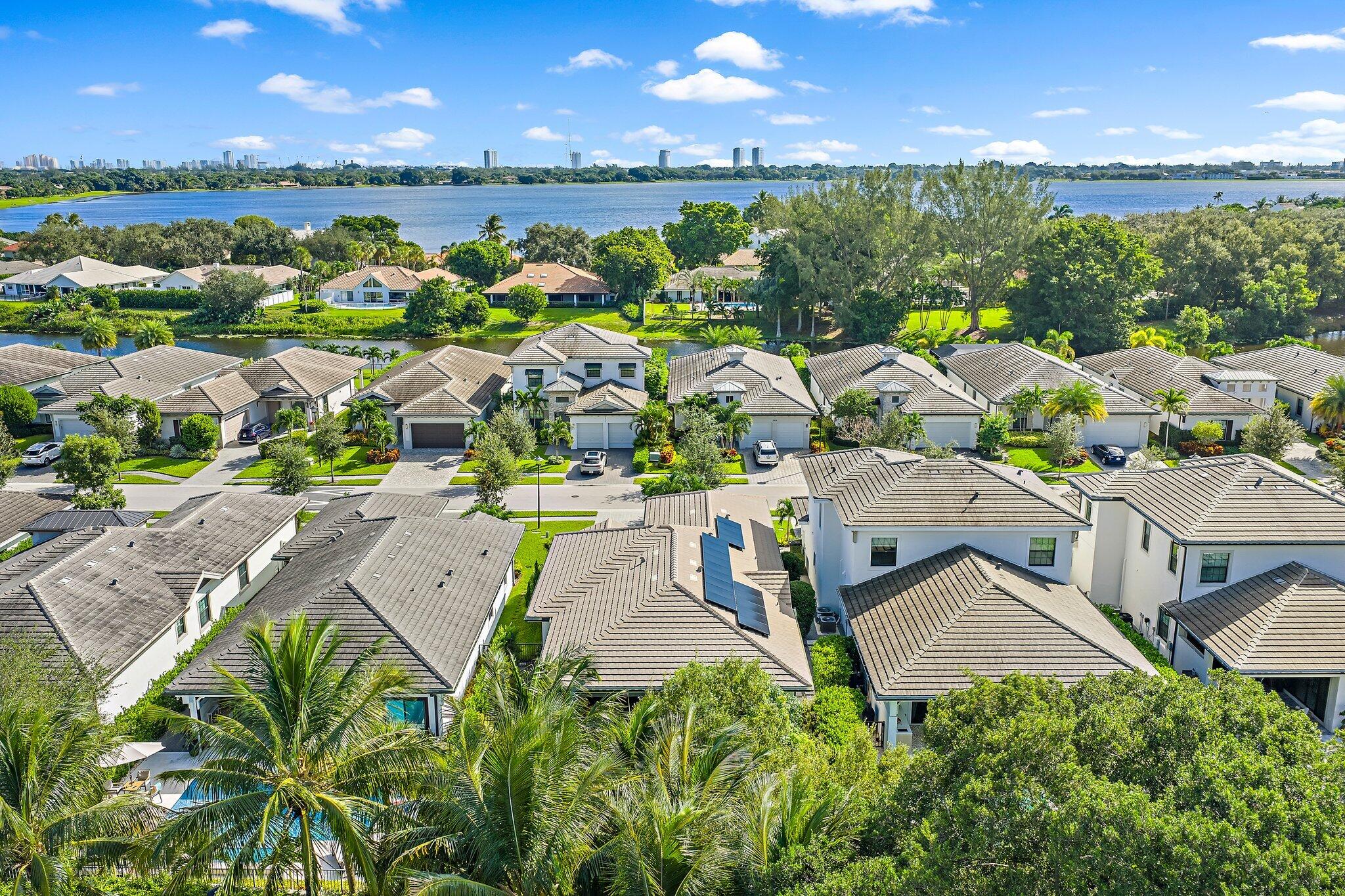 2908 Gin Berry Way West Palm Beach, FL 33401 - Photo 56 of 70 an aerial view of a house with a lake view