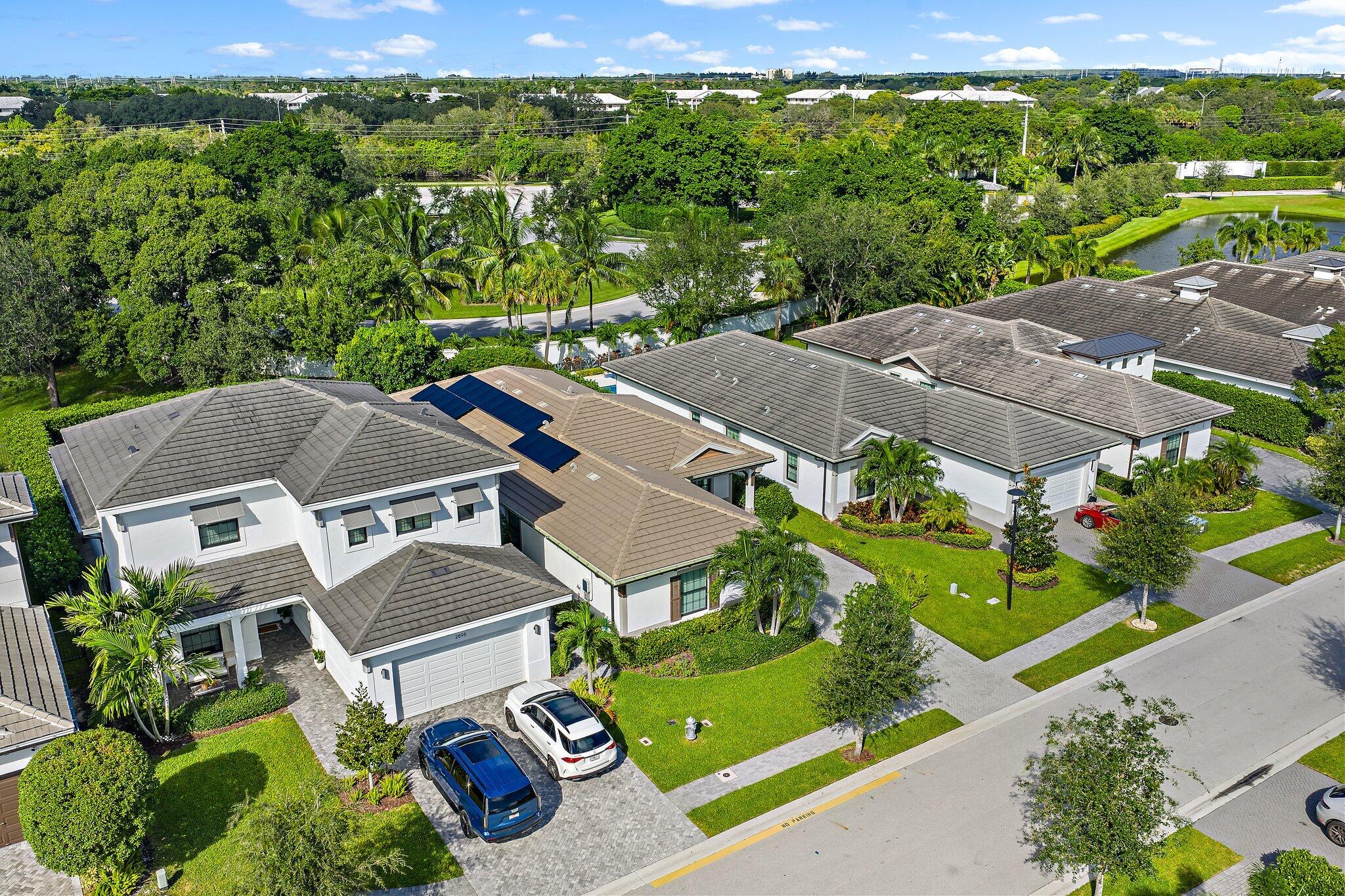 2908 Gin Berry Way West Palm Beach, FL 33401 - Photo 59 of 70 an aerial view of residential house with outdoor space and street view