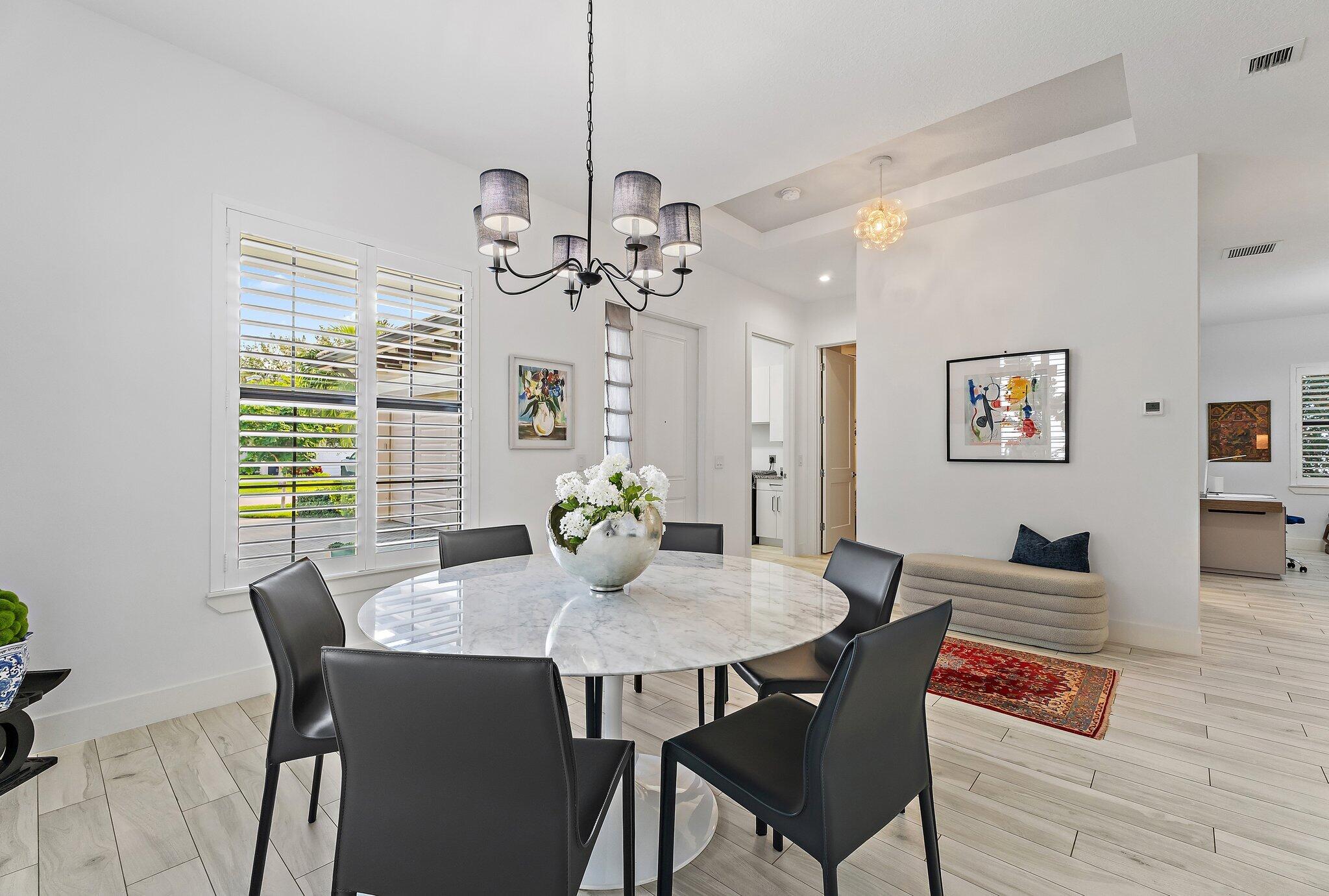 2908 Gin Berry Way West Palm Beach, FL 33401 - Photo 6 of 70 a view of a dining room with furniture window and wooden floor