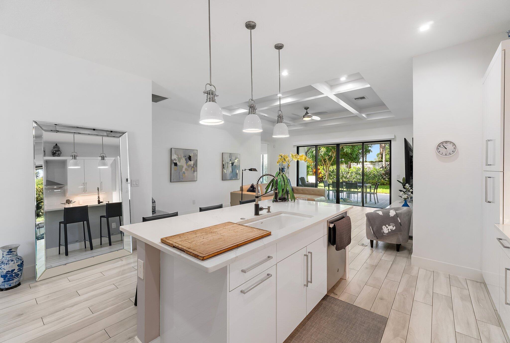 2908 Gin Berry Way West Palm Beach, FL 33401 - Photo 10 of 70 a large kitchen with kitchen island a large island in it