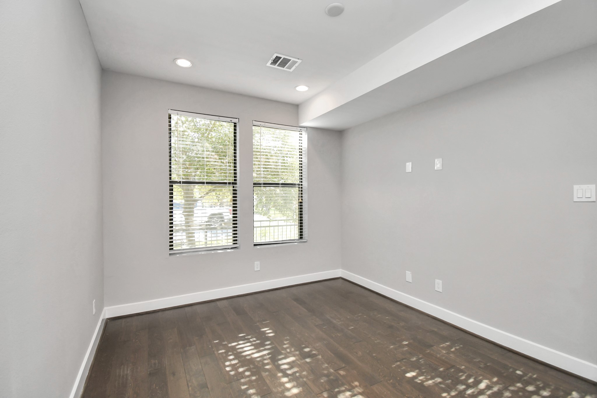 308 Palmer Street Houston, TX 77003 - Photo 15 of 36 an empty room with wooden floor and windows