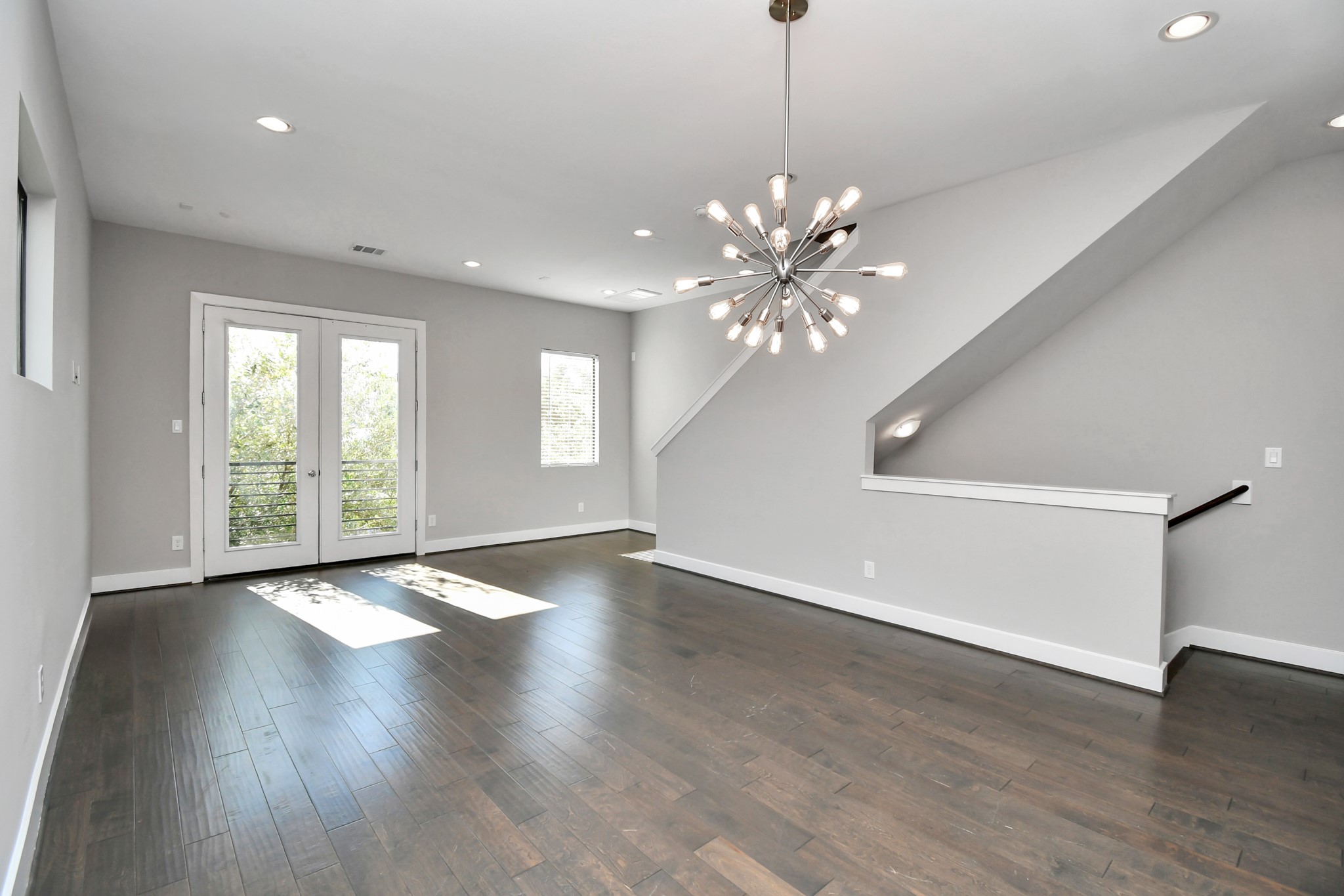 308 Palmer Street Houston, TX 77003 - Photo 18 of 36 a view of an empty room with wooden floor and a window