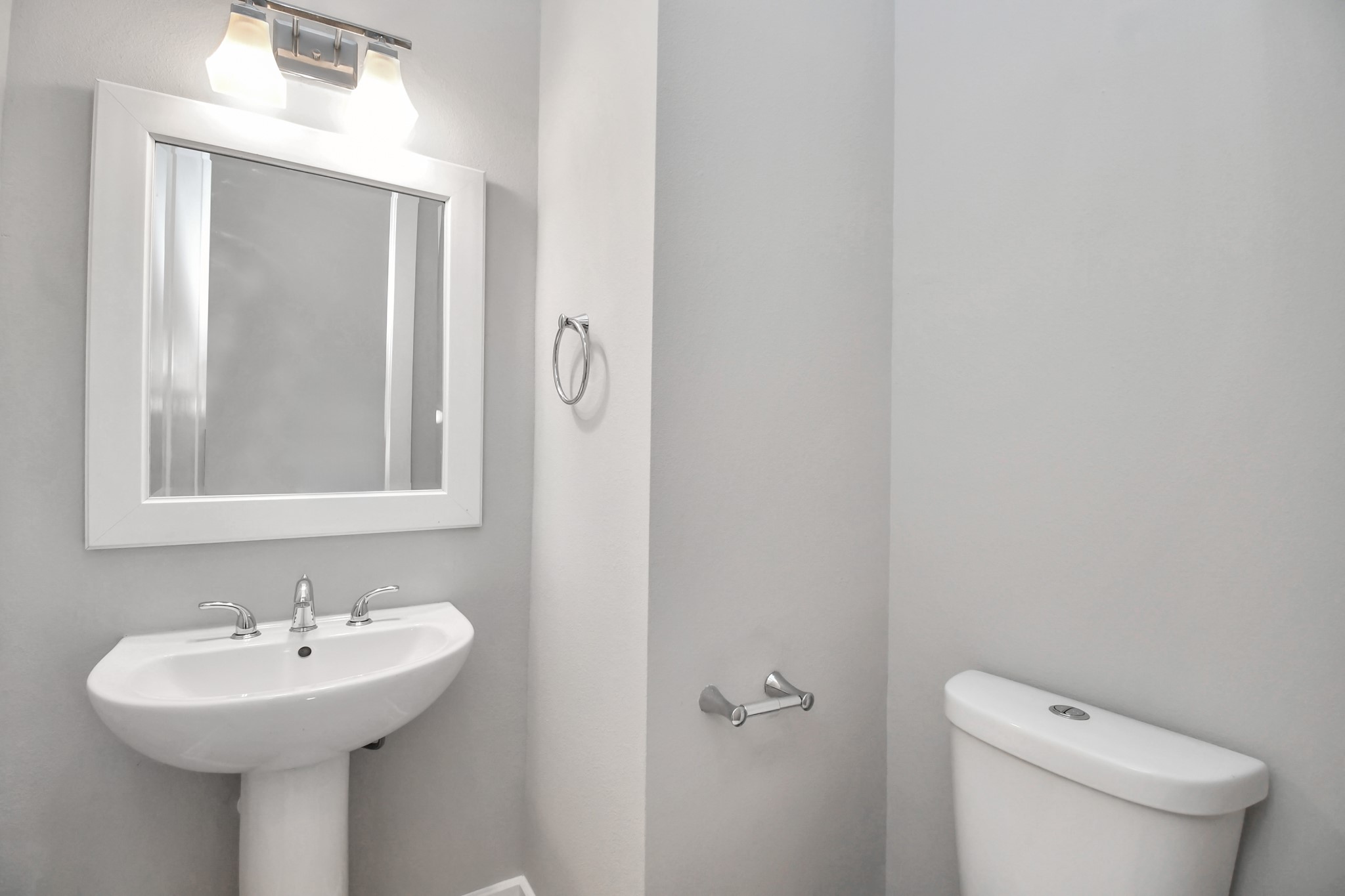 308 Palmer Street Houston, TX 77003 - Photo 20 of 36 a bathroom with a sink a toilet and mirror