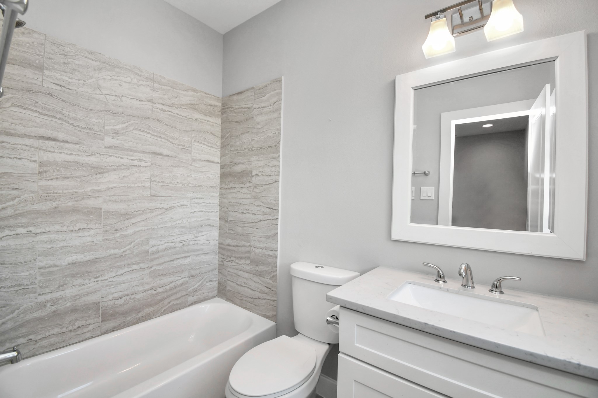 308 Palmer Street Houston, TX 77003 - Photo 30 of 36 a bathroom with a granite countertop sink toilet and shower