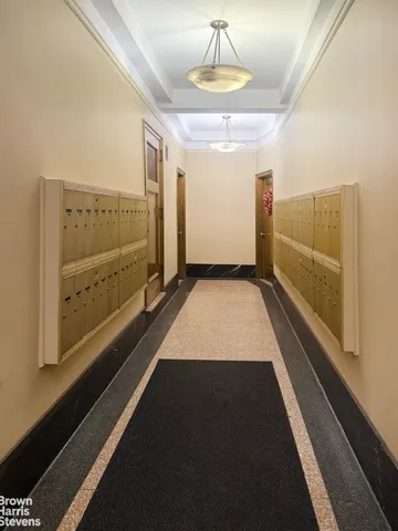 a living room with furniture and a mirror