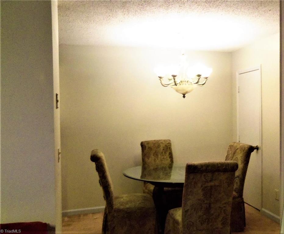 5669 Hornaday Road Greensboro, NC 27409 - Photo 6 of 13 Dining area with pantry to the right.