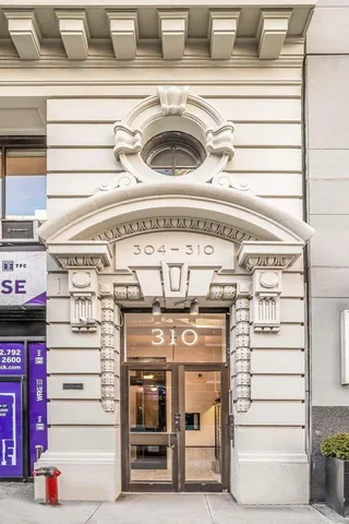 a view of a chair and tables in the patio