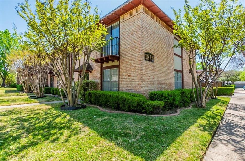 1821 East Grauwyler Road, Unit 188 Irving, TX 75061 - Photo 16 of 20 Brick exterior featuring a second-story balcony with iron railing