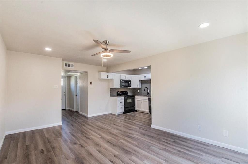 1821 East Grauwyler Road, Unit 188 Irving, TX 75061 - Photo 5 of 20 Open-concept living space featuring wood-finish flooring, recessed lighting, and a contemporary ceiling fan