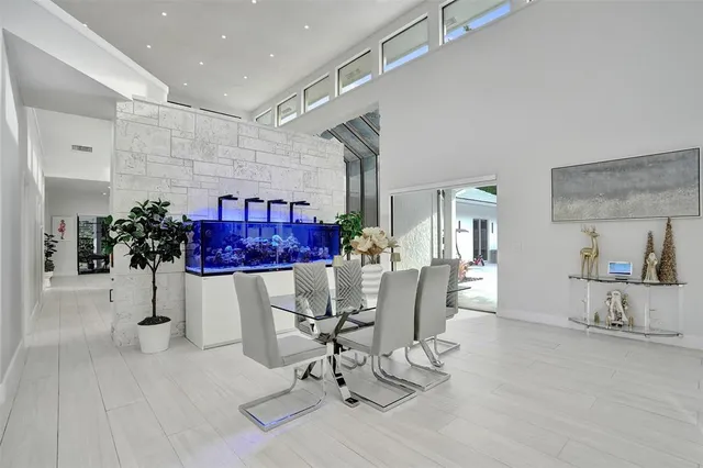 a kitchen with stainless steel appliances a white cabinets and a stove