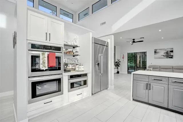 a bedroom with a large bed and a couch