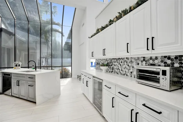 a living room with furniture a ceiling fan and a rug