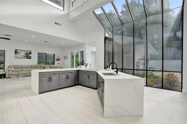 a bed room with furniture and a flat screen tv