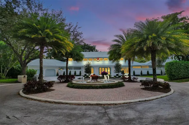 a living room with furniture and flowers