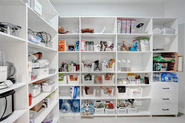 a view of a kitchen with appliances and cabinets