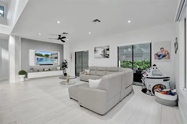 a bathroom with a granite countertop sink a mirror and shower