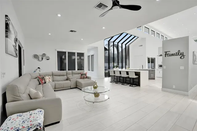 a spacious bathroom with a tub sink and mirror