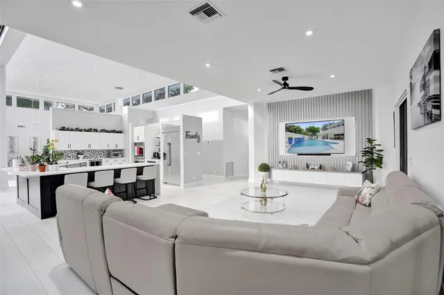 a spacious bathroom with a granite countertop sink and a mirror