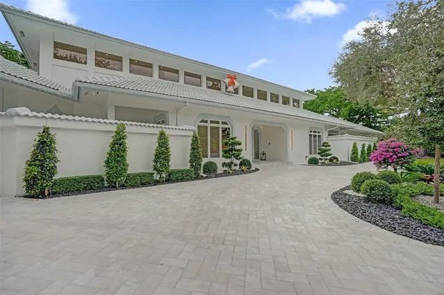 a view of a dining room with furniture and a chandelier