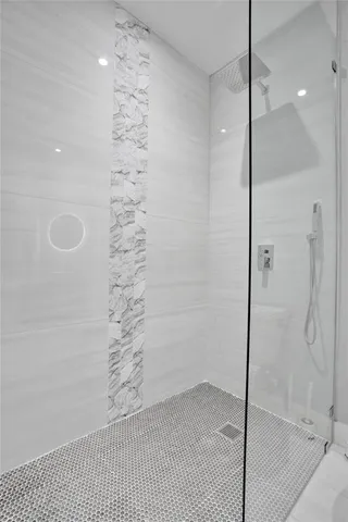 a kitchen with a stove a refrigerator and trees