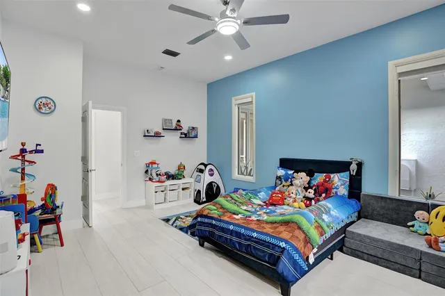 a view of a yard in front of a house with a large tree