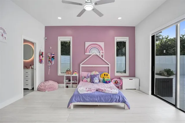 an aerial view of a house with garden space and street view