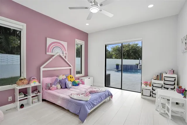 an aerial view of a house with yard swimming pool and outdoor seating