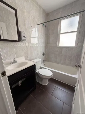 a bathroom with a sink a toilet and a bathtub