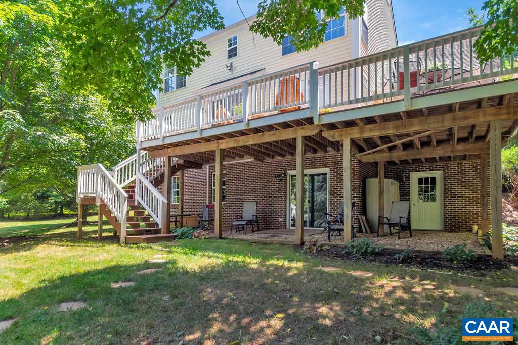 5363 Windy Ridge Road Charlottesville, VA 22903 - Photo 37 of 49 a view of a house with backyard porch and sitting area