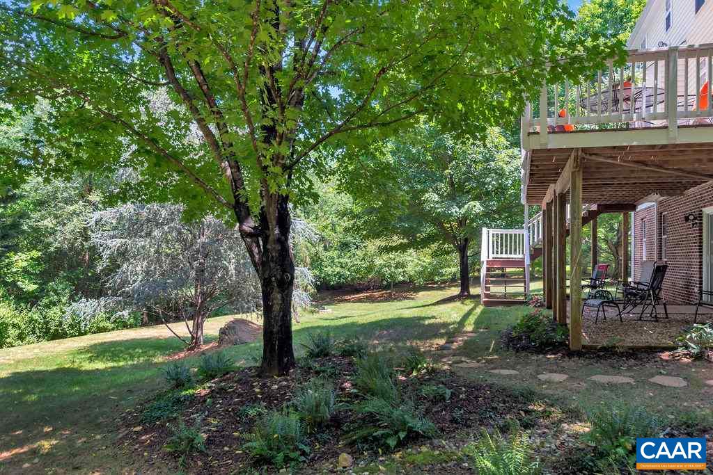 5363 Windy Ridge Road Charlottesville, VA 22903 - Photo 39 of 49 a view of a patio with table and chairs and potted plants