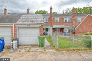1618 Roundhill Road Baltimore, MD 21218 - Photo 47 of 50 a front view of a house with a yard