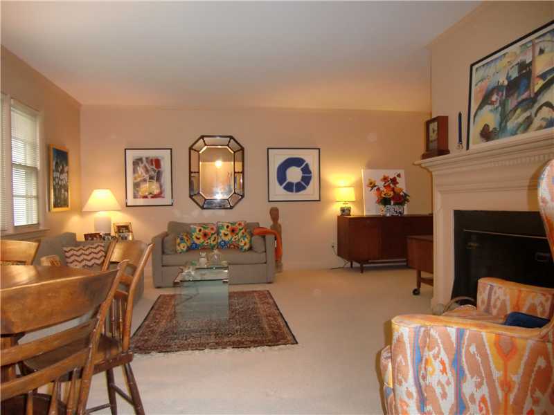 7 Dorchester Lane Riverside, CT 06878 - Photo 2 of 7 a bedroom with furniture and a fireplace
