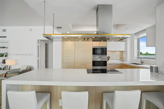 a dining room with furniture and chandelier